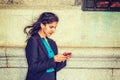 East Indian American college student texting outside in New York Royalty Free Stock Photo