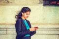 East Indian American college student texting outside in New York Royalty Free Stock Photo