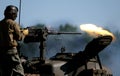 East Kirkby. Lincolnshire aviation heritage trust. UK, August 2021. Man firing M2 50 calibre and carbine