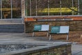 View of a benches with COVID safety messaging on the campus of MSU