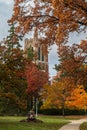 East Lansing MI - October 18, 2022:Beaumont tower during the Fall with lawnmower