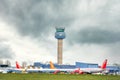 East Midlands Airport Kegworth Leicestershire radio air traffic Control tower and aircraft planes waiting depart modern terminal.
