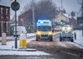 East Midlands Ambulance Service 999 emergency response blue lights severe weather heavy snowfall icy road NHS paramedic driving