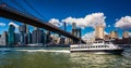 The East River Ferry, Brooklyn Bridge and Manhattan Skyline seen