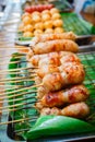 East sausage being grilled, Thai food style. Royalty Free Stock Photo