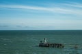 East side light tower at entrance to port of Dunkerque, France