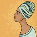 East suntanned girl in a traditional turban. Profile view.