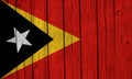 East Timor Flag Over Wood Planks