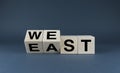 East vs west. Cubes form words east or west