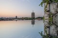 East and west towers of Kaiyuan Temple at dusk, with mirror reflection in foreground in Quanzhou