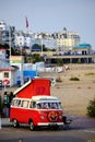 Bright red Volkswagen Westfalia camper van with extended pop-up roof