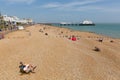 Eastbourne England with couple on the beach in deckchairs