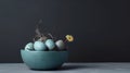 Easter abstract composition with painted eggs in blue bowl plants and flowers on dark background in modern style pastel colors Royalty Free Stock Photo