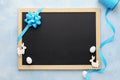 Easter background with chalkboard, blue ribbon and cute bunny