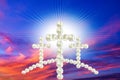 Easter background. Christian cross against celestial clouds.