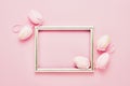 Easter background. Decorative pink Easter Eggs and tulip flowers on pink background. Top view, copy space. Easter celebration