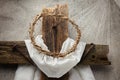 Easter background depicting the crucifixion with a rustic wooden cross, crown of thorns and nails. Royalty Free Stock Photo