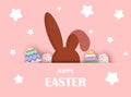 Easter background. Easter bunny looks out with eggs