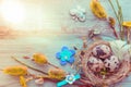 Easter background with Easter eggs and spring flowers. Top view with copy space Royalty Free Stock Photo