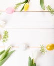 Easter background with Easter eggs and spring flowers. Top view with copy space Royalty Free Stock Photo