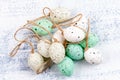 Easter background with Easter eggs, pastel colours decoration on old painted white background