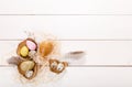 Easter background with Easter eggs and spring flowers. Top view with copy space Royalty Free Stock Photo