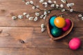 Easter background with Easter colorful eggs and spring flowers. Top view with copy space Royalty Free Stock Photo