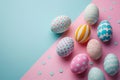 Easter background with few decorated Easter eggs with geometric patterns, on pastel colored background.