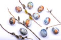 Easter background flat lay with branches pussy willows and colorful painted eggs on white Royalty Free Stock Photo