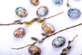 Easter background flat lay with branches pussy willows and colorful painted eggs on white Royalty Free Stock Photo