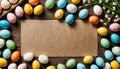 Easter background with hand painted eggs and empty card with copy space for text Royalty Free Stock Photo