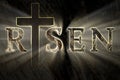 Easter background with Jesus Christ cross and risen text written, engraved, carved on stone Royalty Free Stock Photo