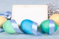 Easter background with painted eggs, pussy-willow and card Royalty Free Stock Photo