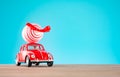 Easter background with red car and Easter egg Royalty Free Stock Photo