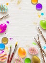 Easter background with space for greeting or message. Pussy-willow branches, paint decorated multicolored eggs