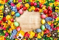 Easter background with spring flowers and colored eggs Royalty Free Stock Photo