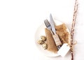 Easter background. Table setting for the holiday of Easter in a rustic style,burlap napkin, quail eggs, fork and knife