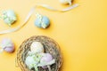 Easter banner. Colourful egg with tape ribbon on pastel yellow background in Happy Easter decoration. Foil minimalist egg design,