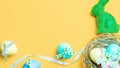 Easter banner. Colourful egg with tape ribbon on pastel yellow background in Happy Easter decoration. Foil minimalist egg design,