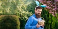 Easter banner, mockup copy space, poster flyer header for website template. Funny man hunting easter eggs. Bearded man