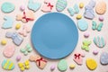 Easter banner on a pastel background. Homemade gingerbread cookies on a blue plate, Easter eggs and cookies in the shape of a