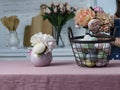 Easter basket with colored eggs and flowers