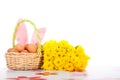 Easter basket with eggs, flowers and bunny ears