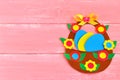 Easter basket with eggs and flowers made of cardboard, on pink wooden background, with space for congratulation to Easter Royalty Free Stock Photo