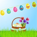 Easter basket with eggs tulips and bunting Royalty Free Stock Photo