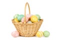 Easter basket filled with Easter Eggs over white