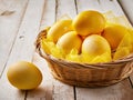 Easter basket full of Easter eggs coloured in yellow Royalty Free Stock Photo