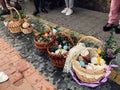 Easter baskets with stylish painted eggs, easter cake, ham,beets, butter, candle with boxwood branches for sanctify at church on Royalty Free Stock Photo