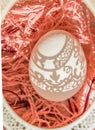 Easter. A beautiful Easter card with an openwork vertical oval frame through which beautiful shadows fall on a white egg. Green