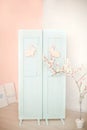 Easter. Blue door with easter bunny. Decorations on the door with Easter bunny. Rustic interior element of the spring porch. Easte